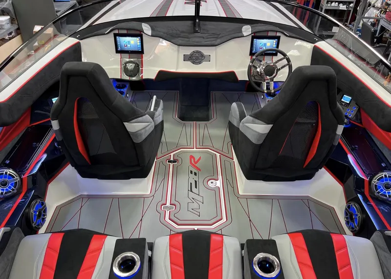 Slide: The Image of 2023 Daves Custom Boats M28R interior with modern dashboard and seating. - 14