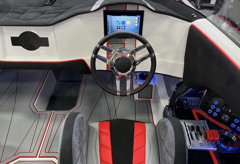 Slide: The Image of 2023 Daves Custom Boats M28R interior with modern steering wheel and control panel. - 5