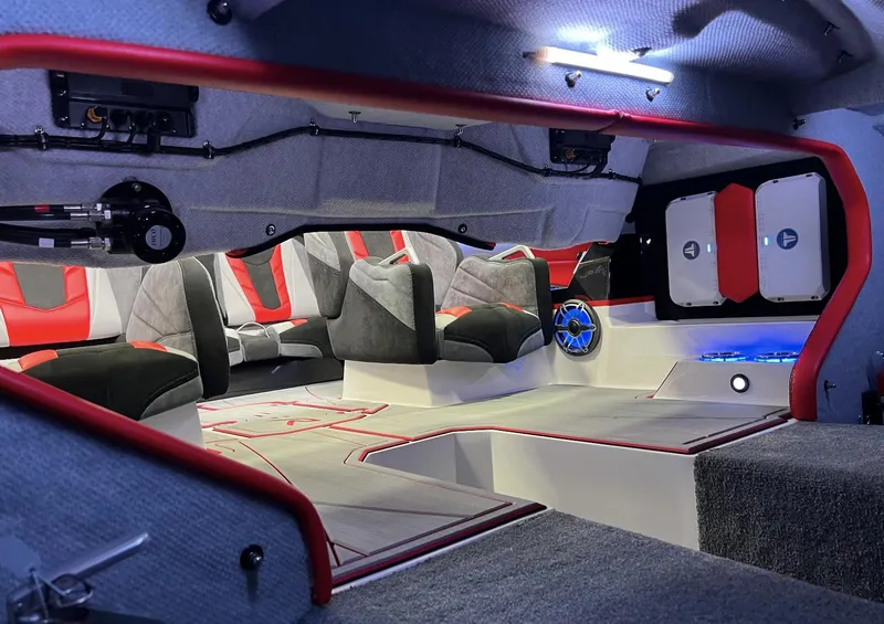 Slide: The Image of Interior of 2023 Daves Custom Boats M28R, featuring modern seating and sleek design elements. - 6