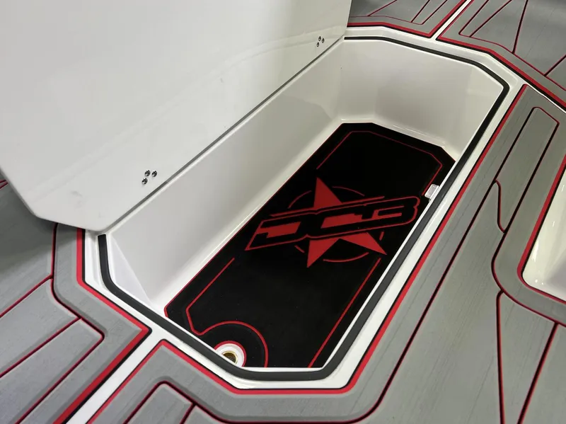 Slide: The Image of 2023 Daves Custom Boats M28R storage compartment with sleek design and red accents. - 8