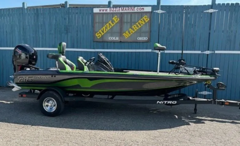 The Image of 2025 Nitro Z18 Pro fishing boat with green accents on a trailer. - 0