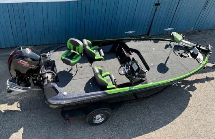 Slide: The Image of 2025 Nitro Z18 Pro fishing boat with green accents, parked on a trailer. - 5