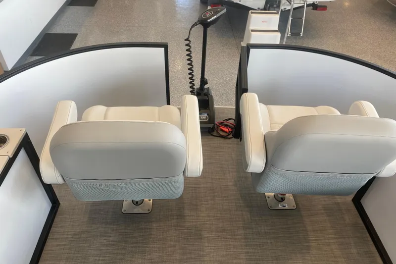 Slide: The Image of Two white seats on a 2025 Lowe SF 212 W boat. - 10