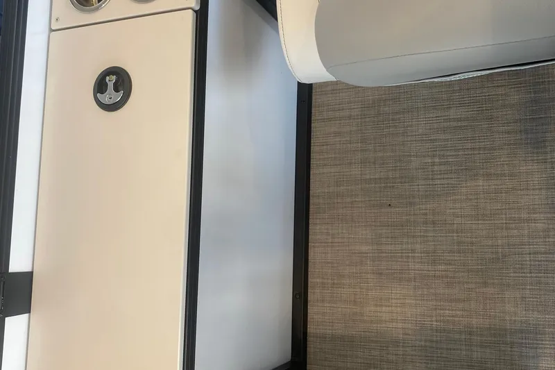 Slide: The Image of Interior of 2025 Lowe SF 212 W boat showing seating and flooring details. - 13