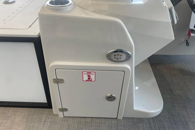 Slide: The Image of 2025 Lowe SF 212 W boat console with fire extinguisher compartment. - 15