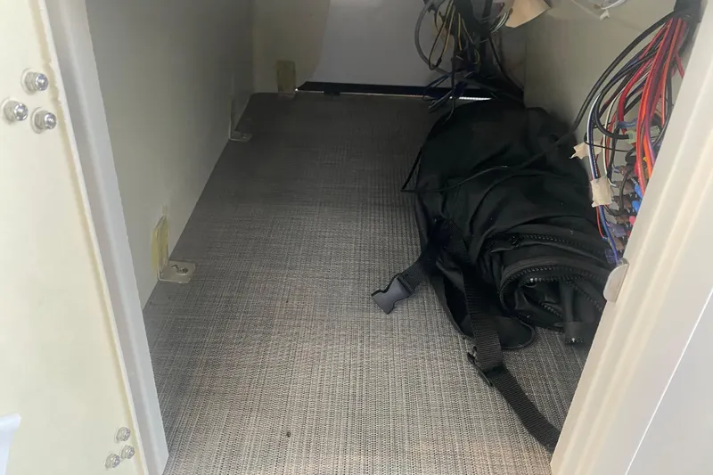 Slide: The Image of Interior storage compartment of 2025 Lowe SF 212 W boat with wiring and equipment. - 16