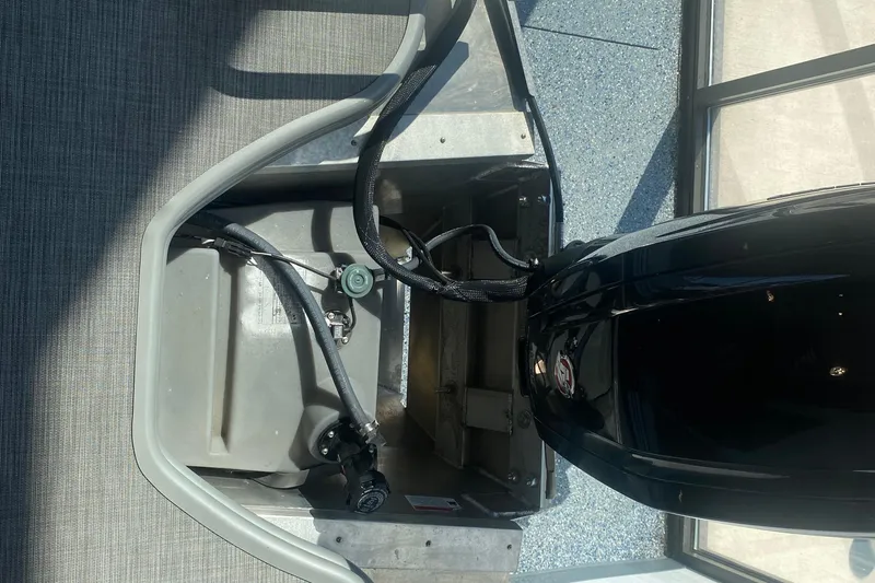 Slide: The Image of 2025 Lowe SF 212 W boat engine compartment with fuel tank and cables. - 21