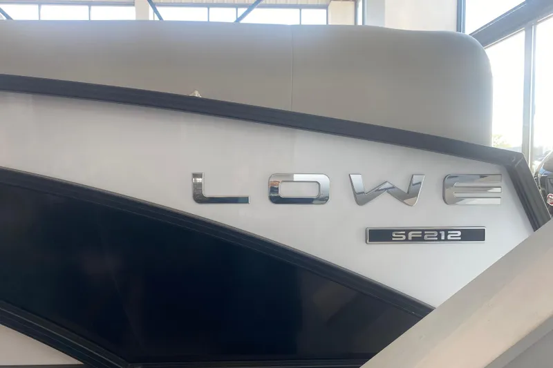 Slide: The Image of 2025 Lowe SF 212 W boat side view with logo and model name. - 4