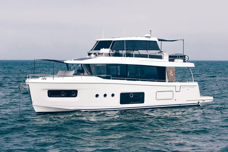 The Image of 2025 Beneteau Swift Trawler 54 cruising on open water. - 0