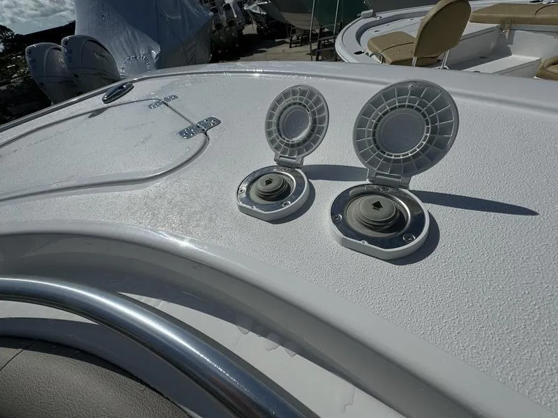 Slide: The Image of Sportsman Open 232 boat deck with open hatches, 2025 model. - 13