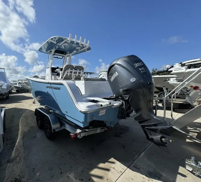 Slide: The Image of 2025 Sportsman Open 232 boat with Yamaha 300 engine on trailer under blue sky. - 3