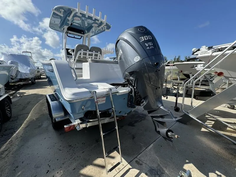Slide: The Image of 2025 Sportsman Open 232 boat with Yamaha 300 V6 engine, docked under clear skies. - 4