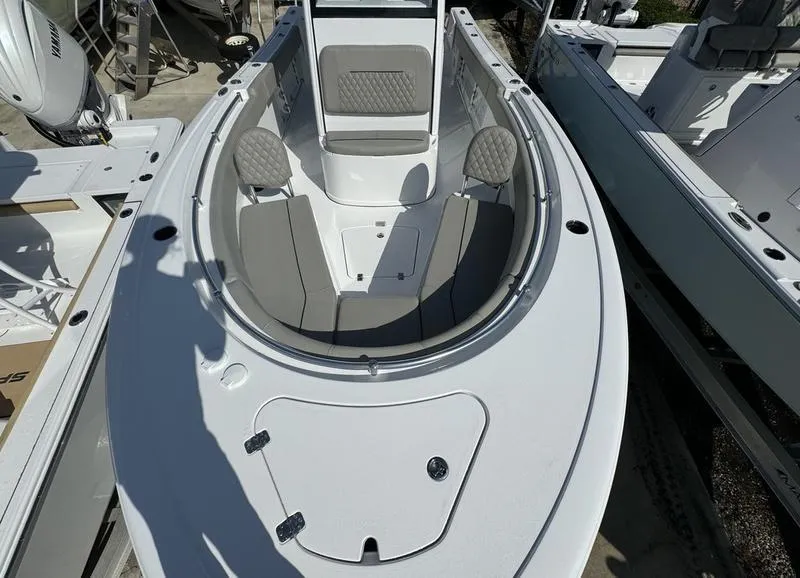 Slide: The Image of 2025 Sportsman Open 232 boat with spacious seating and modern design. - 9