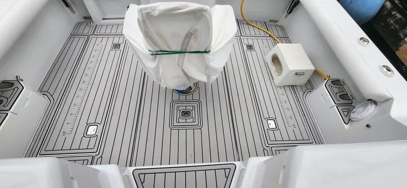 Slide: The Image of 1995 Cabo 35 Express boat deck with custom flooring and covered seat. - 39