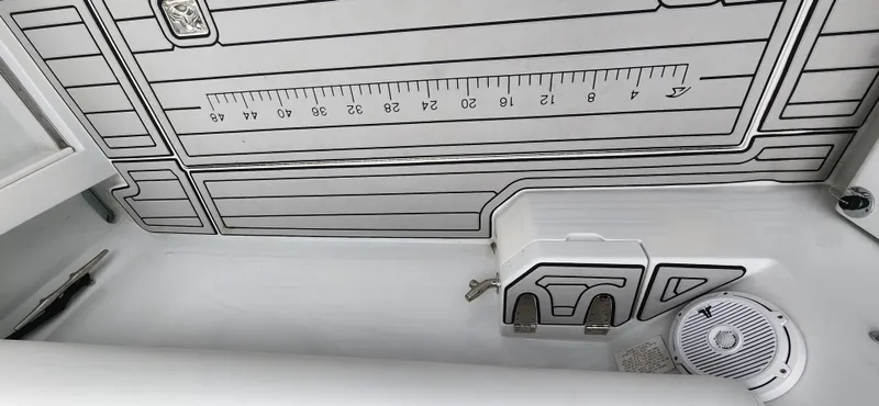 Slide: The Image of 1995 Cabo 35 Express boat deck with ruler and speaker. - 44