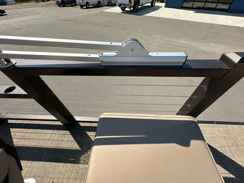 Slide: The Image of Pontoon boat deck with railing, Lake Lounger 13FISH4E, 2021 model, in a parking area. - 10