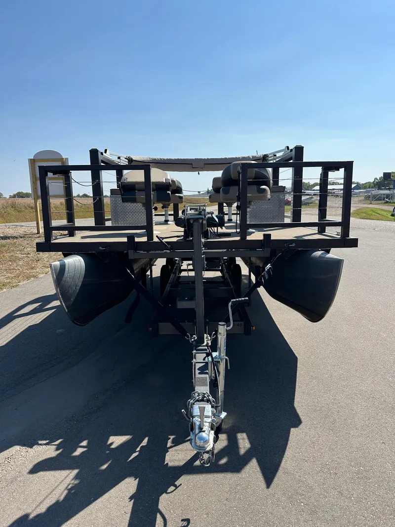 Slide: The Image of 2021 Lake Lounger 13FISH4E pontoon trailer on a sunny road. - 2