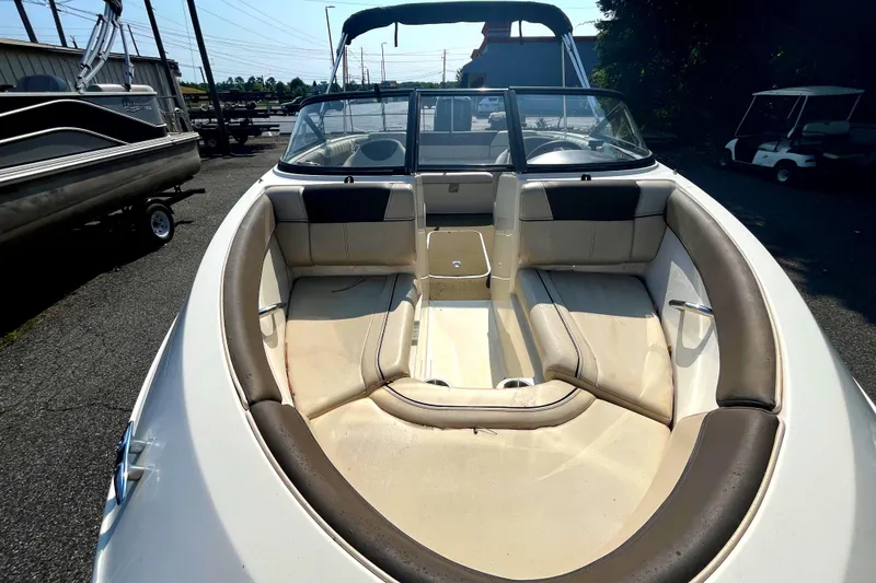 Slide: The Image of 2018 Bayliner 180 Bowrider boat interior with spacious seating and windshield. - 3