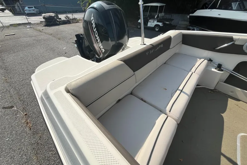 Slide: The Image of 2018 Bayliner 180 Bowrider boat with Mercury outboard engine, featuring spacious seating. - 6