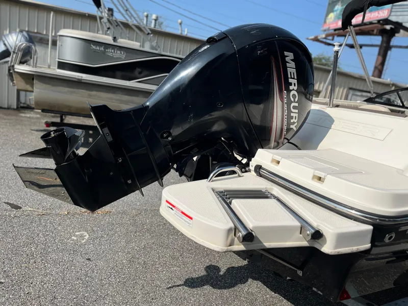 Slide: The Image of 2018 Bayliner 180 Bowrider with Mercury outboard motor, rear view. - 7