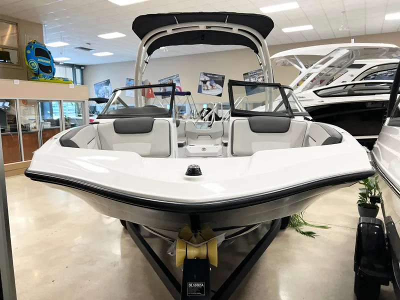 Slide: The Image of 2025 Yamaha Boats AR190 displayed in a showroom, featuring sleek design and modern amenities. - 2