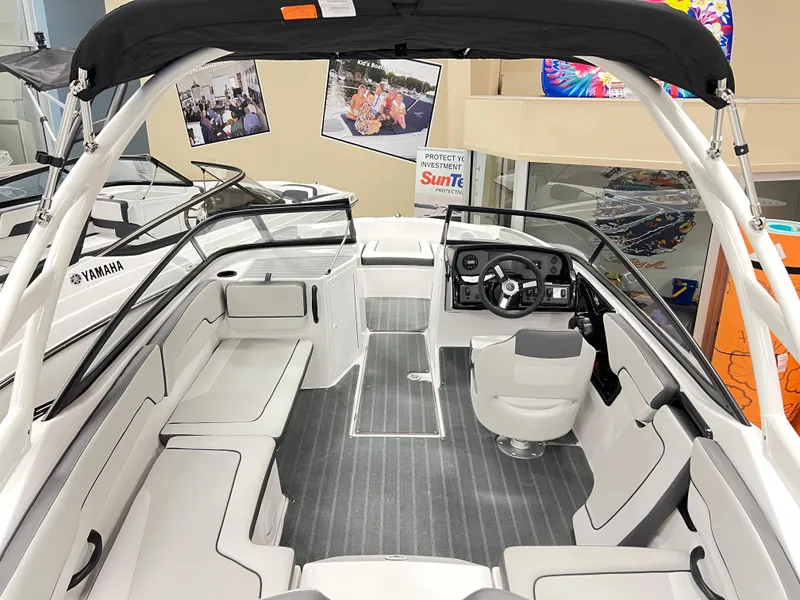 Slide: The Image of 2025 Yamaha Boats AR190 interior with sleek seating and modern dashboard design. - 5