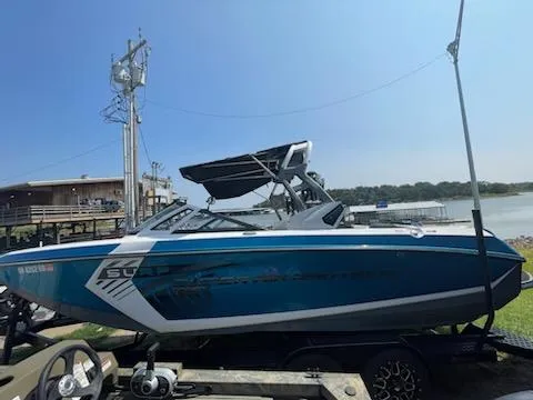The Image of 2017 Nautique Super Air Nautique G23 boat by the lake on a sunny day. - 0