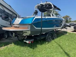 Slide: The Image of 2017 Nautique Super Air Nautique G23 boat interior with premium seating and sound system. - 4