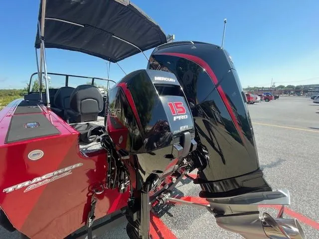 Slide: The Image of 2025 Tracker Targa V-19 Combo boat with dual Mercury outboard motors. - 2