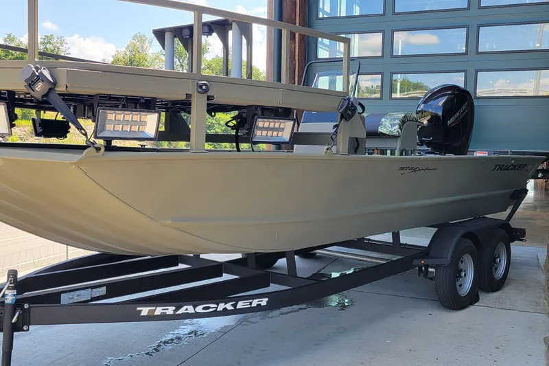 The Image of 2025 Tracker Grizzly 2072 CC Sportsman boat on trailer, featuring Mercury engine. - 0