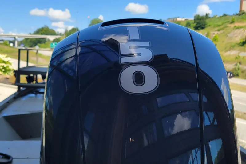 Slide: The Image of Outboard motor with "150" label on a 2025 Tracker Grizzly 2072 CC Sportsman boat. - 3