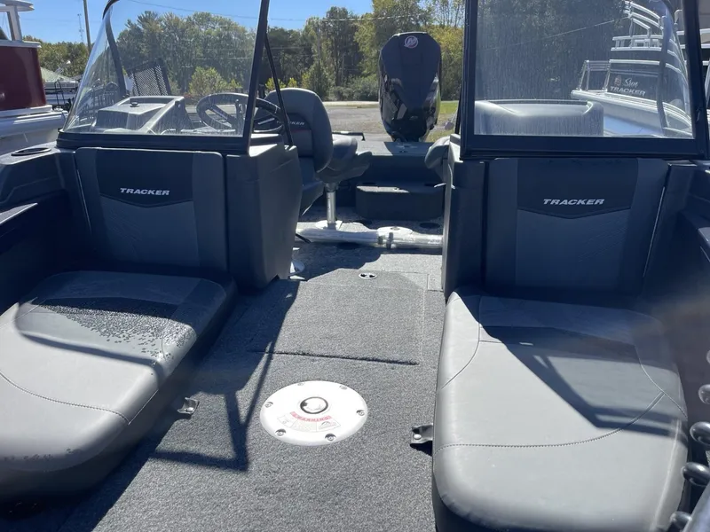 Slide: The Image of 2025 Tracker Targa V-19 Combo boat interior with seating and steering wheel. - 10