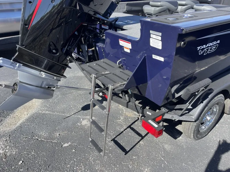 Slide: The Image of 2025 Tracker Targa V-19 Combo boat with motor and ladder on trailer. - 11