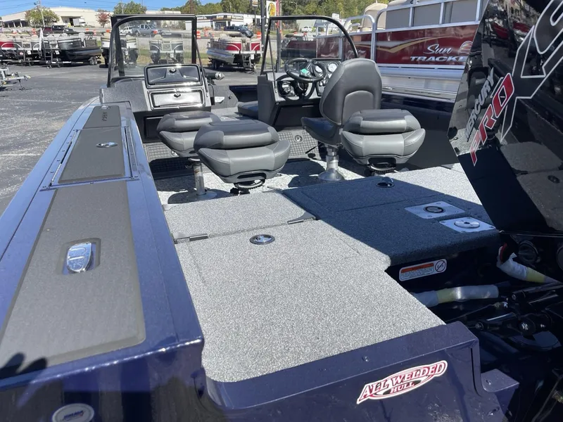 Slide: The Image of 2025 Tracker Targa V-19 Combo boat interior with seating and dashboard. - 4