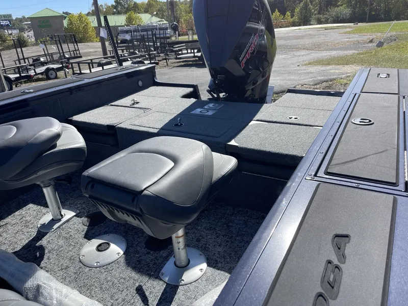 Slide: The Image of 2025 Tracker Targa V-19 Combo boat interior with seating and storage compartments. - 7