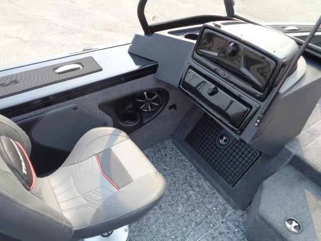 Slide: The Image of 2025 Tracker Targa V-19 WT boat interior with gray seating and dashboard. - 10