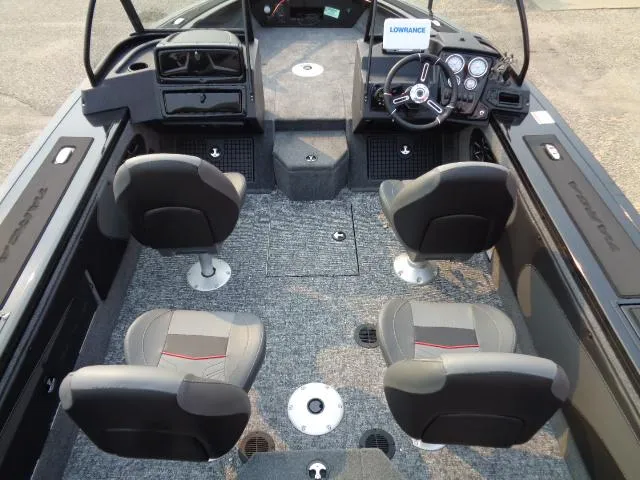 Slide: The Image of 2025 Tracker Targa V-19 WT boat interior with four seats and modern dashboard. - 6