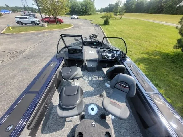 Slide: The Image of 2025 Tracker Targa V-19 Combo boat interior with seating and steering wheel. - 4