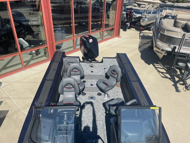 Slide: The Image of 2025 Tracker Targa V-19 Combo boat with seating, displayed outdoors. - 3