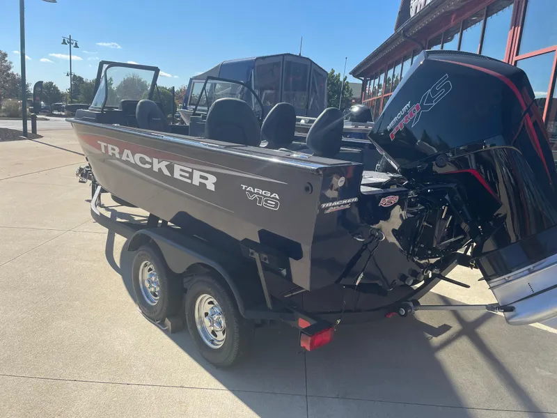 Slide: The Image of 2025 Tracker Targa V-19 Combo boat on trailer, parked outdoors. - 5