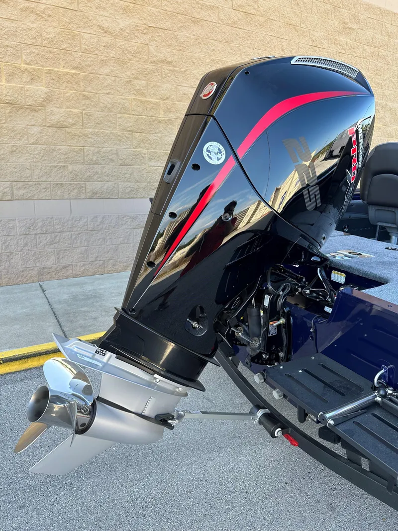 Slide: The Image of 2025 Tracker Targa V-19 Combo boat engine with sleek black and red design. - 3