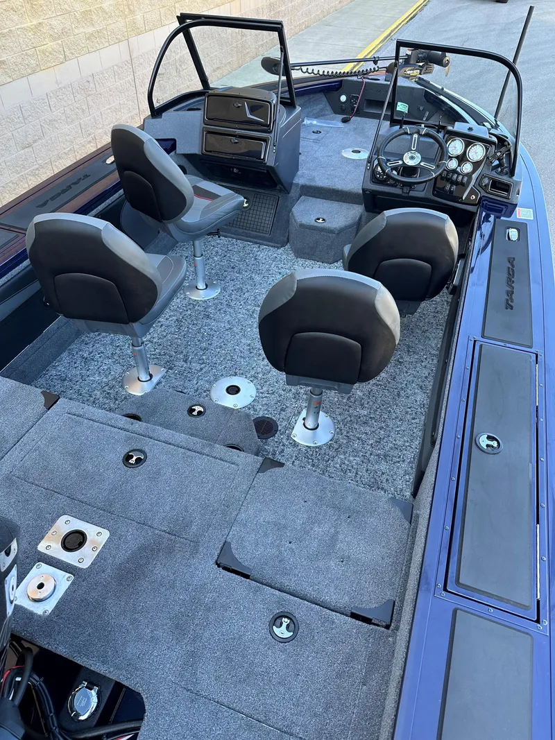 Slide: The Image of 2025 Tracker Targa V-19 Combo boat interior with seating and control panel. - 4