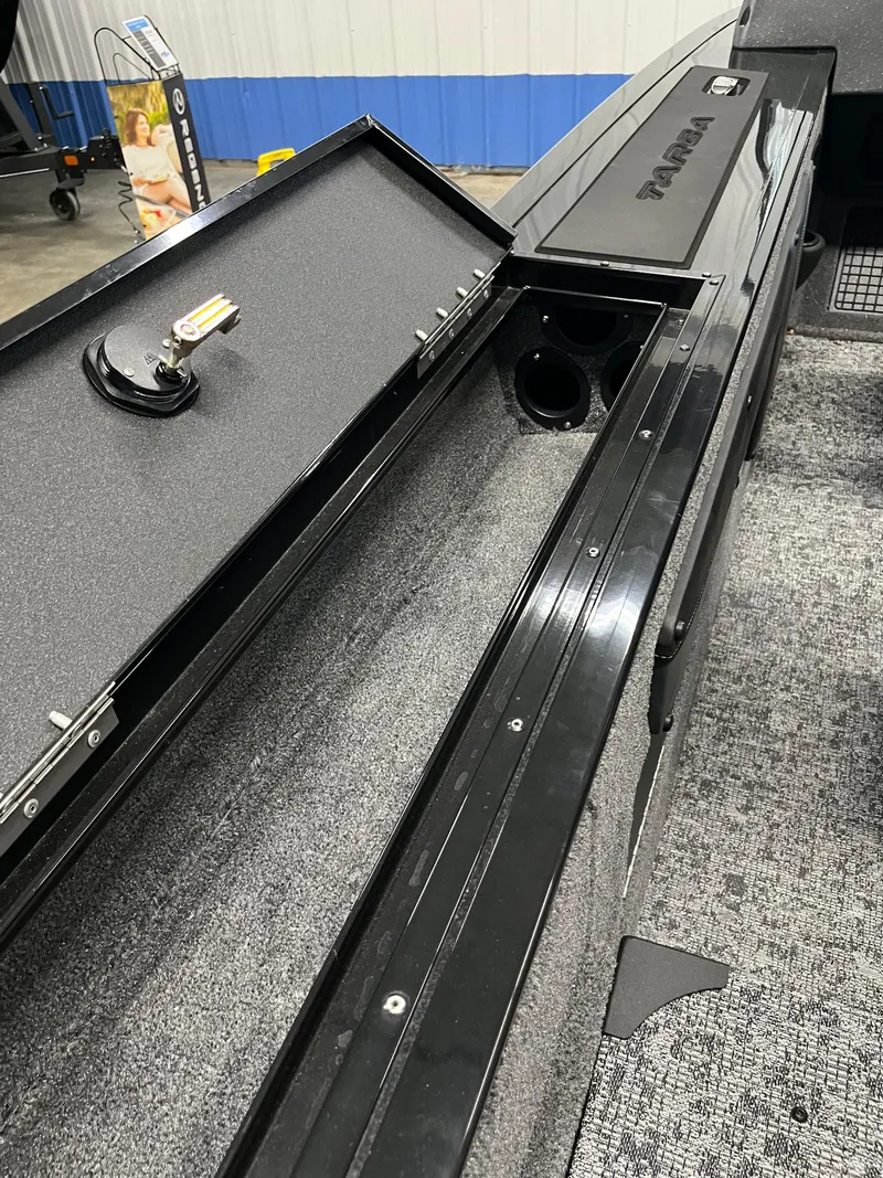 Slide: The Image of 2025 Tracker Targa V-19 Combo boat interior storage compartment detail. - 17