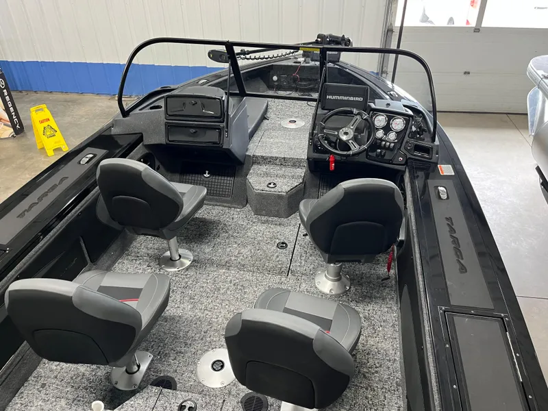 Slide: The Image of 2025 Tracker Targa V-19 Combo boat interior with four seats and steering console. - 21