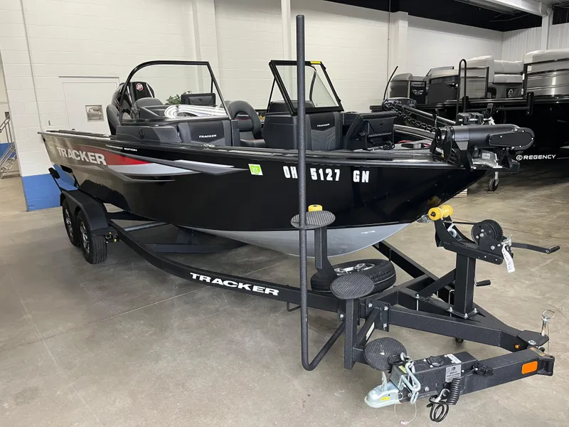 Slide: The Image of 2025 Tracker Targa V-19 Combo boat on trailer in showroom. - 22