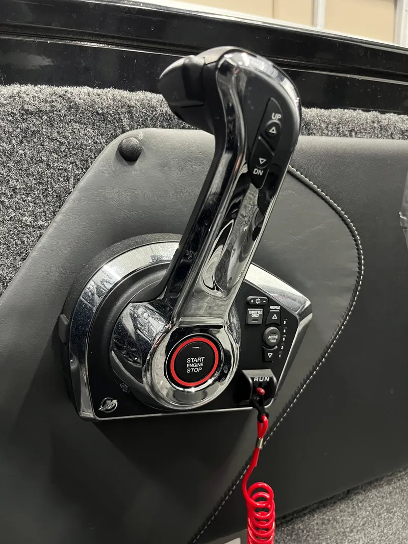 Slide: The Image of Throttle control of 2025 Tracker Targa V-19 Combo boat, featuring start/stop button and red safety cord. - 23