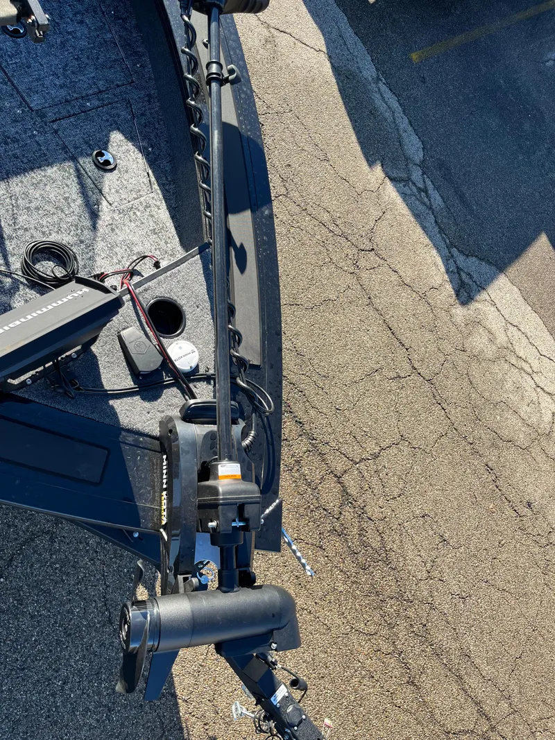 Slide: The Image of 2025 Tracker Targa V-19 Combo boat detail, showing trolling motor and deck components. - 24