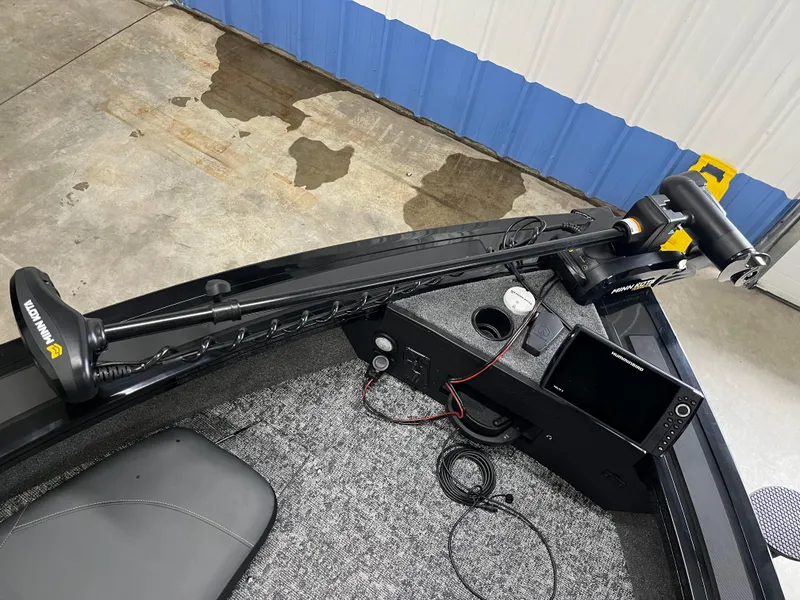 Slide: The Image of 2025 Tracker Targa V-19 Combo boat interior with trolling motor and control panel. - 29