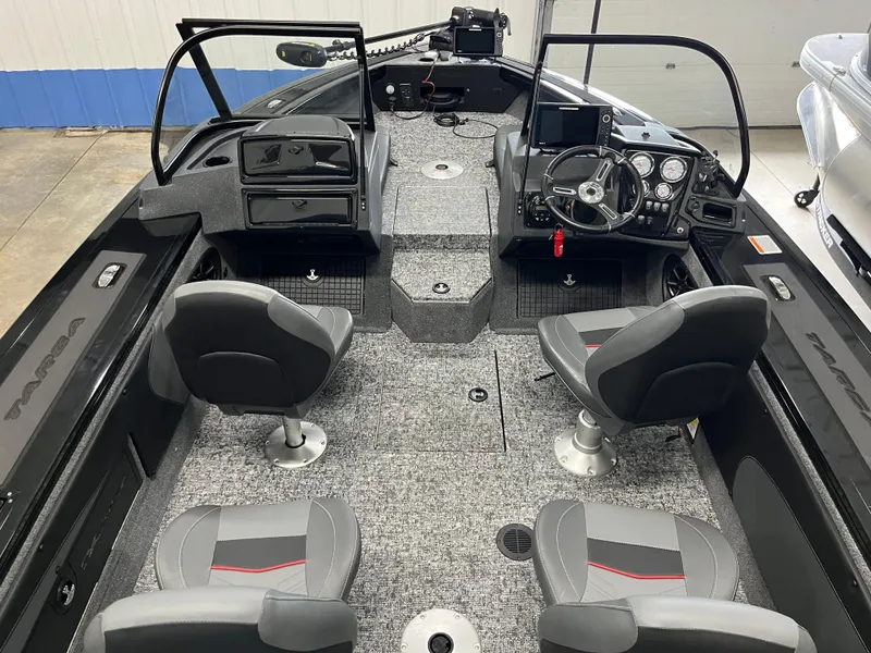 Slide: The Image of 2025 Tracker Targa V-19 Combo boat interior with four seats and modern dashboard. - 4