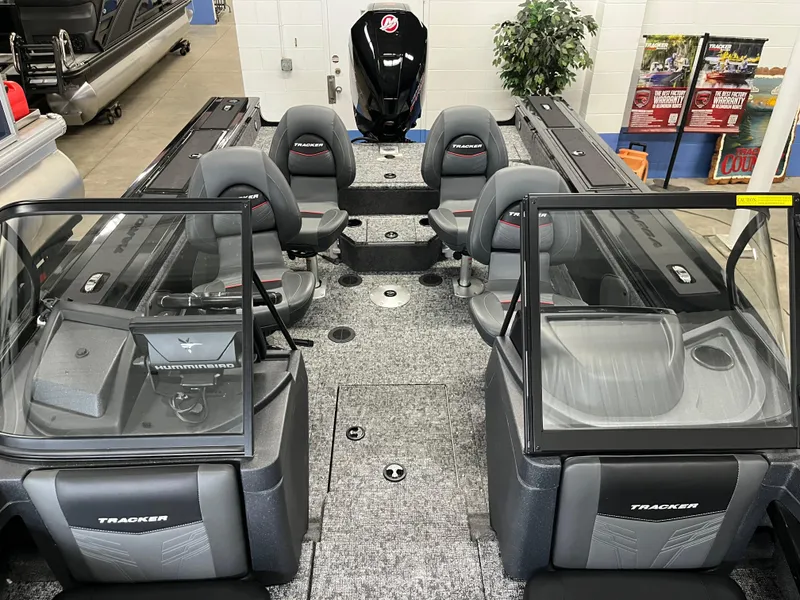 Slide: The Image of 2025 Tracker Targa V-19 Combo boat interior with seating and console view. - 6
